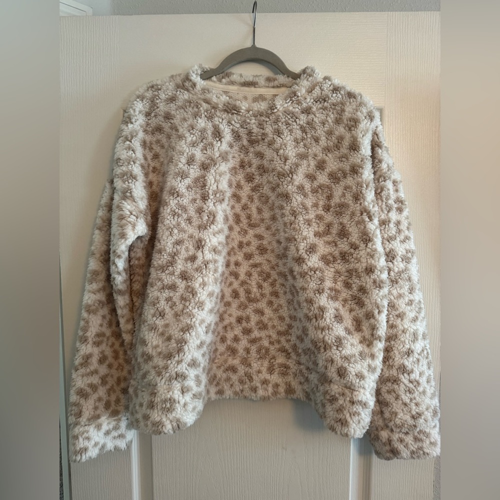 tan and white patterned sweater